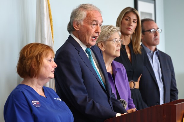 Sen. Ed Markey talks to Elen MacInnis, Sen. Elizabeth Warren, Rep. Lori Trahan and Tim Foley, as Sen. Markey, Warren, Rep. Trahan vs. Steward Health on Sept. 5. (Staff Photo By Stuart Cahill/Boston Herald )